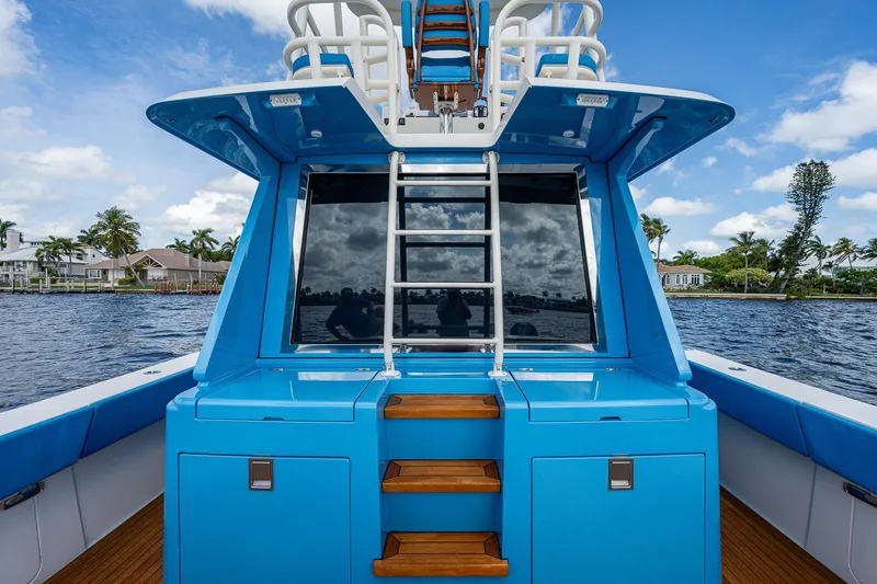 Mother Mary Yacht Photos Pics 2021 Gulf Crosser 52 yacht with blue exterior and ladder on deck.