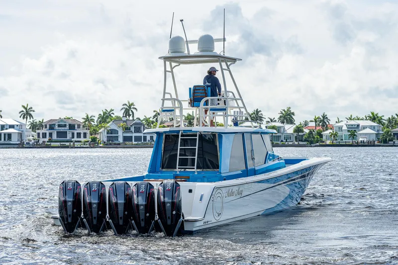 Mother Mary Yacht Photos Pics 2021 Gulf Crosser 52 boat with multiple outboard engines cruising on water.