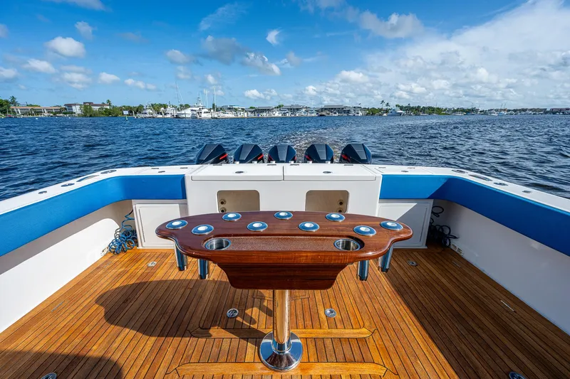 Mother Mary Yacht Photos Pics 2021 Gulf Crosser 52 boat deck with wooden flooring and ocean view.