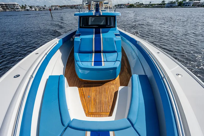 Mother Mary Yacht Photos Pics 2021 Gulf Crosser 52 boat with blue and white seating on the water.