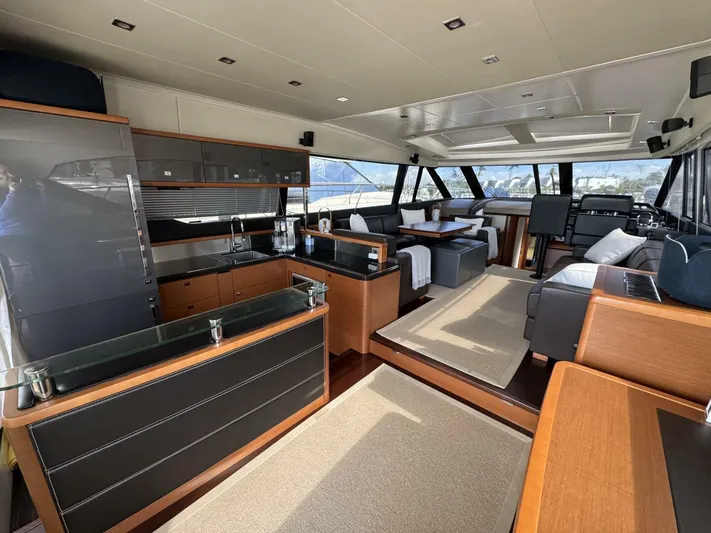 Blue Haven Yacht Photos Pics Luxurious interior of 2014 Prestige 620S yacht with modern kitchen and seating area.