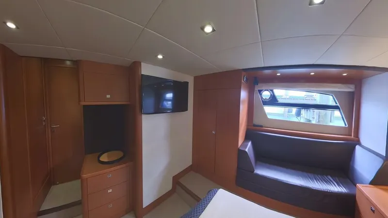 Blue Haven Yacht Photos Pics Luxurious interior of 2014 Prestige 620S yacht with modern furnishings and large window.