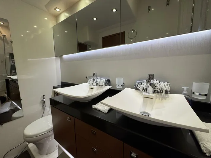 Blue Haven Yacht Photos Pics Luxurious bathroom with dual sinks in a 2014 Prestige 620S yacht.