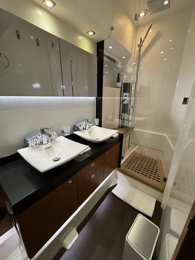 Blue Haven Yacht Photos Pics Luxurious bathroom in 2014 Prestige 620S yacht with dual sinks and modern shower.