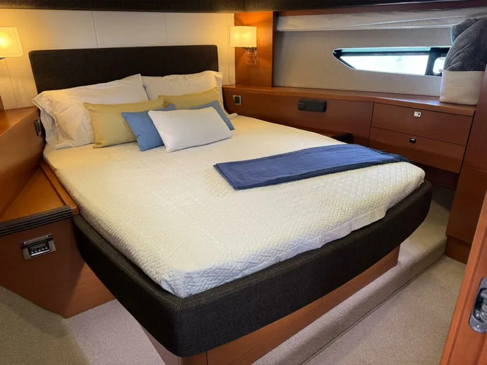 Blue Haven Yacht Photos Pics Luxurious bedroom interior of 2014 Prestige 620S yacht with modern design and cozy bedding.