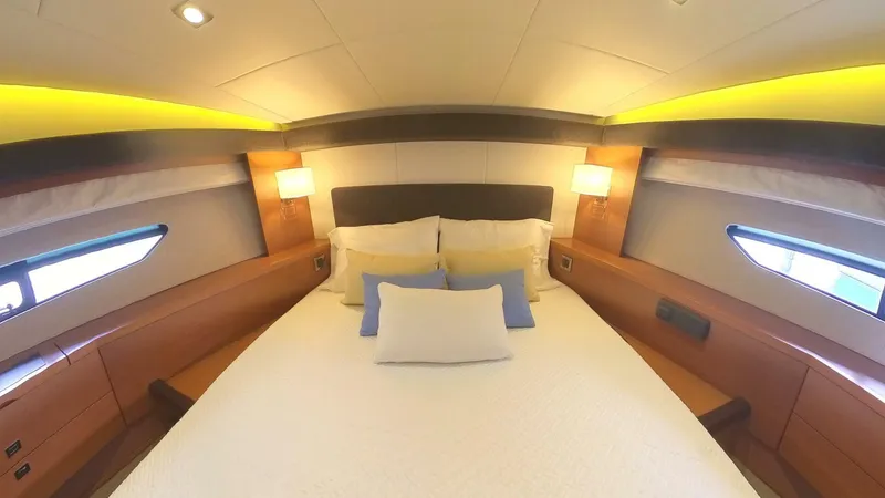 Blue Haven Yacht Photos Pics Luxurious bedroom interior of 2014 Prestige 620S yacht with modern lighting and cozy bedding.
