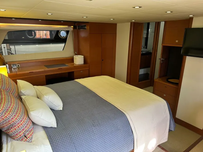 Blue Haven Yacht Photos Pics Luxurious bedroom interior of 2014 Prestige 620S yacht with modern furnishings and cozy bedding.