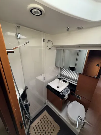 Blue Haven Yacht Photos Pics Luxurious bathroom in 2014 Prestige 620S yacht with modern fixtures and sleek design.
