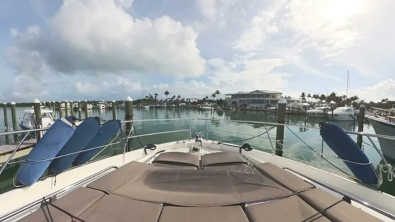 Blue Haven Yacht Photos Pics Prestige 620S yacht docked in a sunny marina, 2014 model.