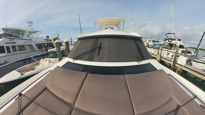 Blue Haven Yacht Photos Pics Prestige 620S 2014 yacht docked at marina, front view with sunpad.