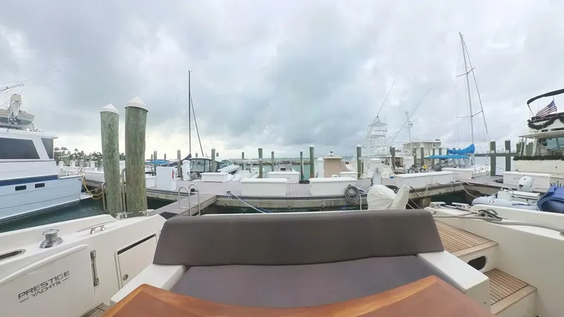 Blue Haven Yacht Photos Pics Prestige 620S yacht docked at marina, cloudy sky, 2014 model.