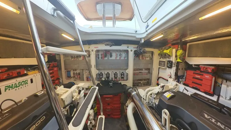 Blue Haven Yacht Photos Pics Engine room of a 2014 Prestige 620S yacht, featuring organized tools and equipment.