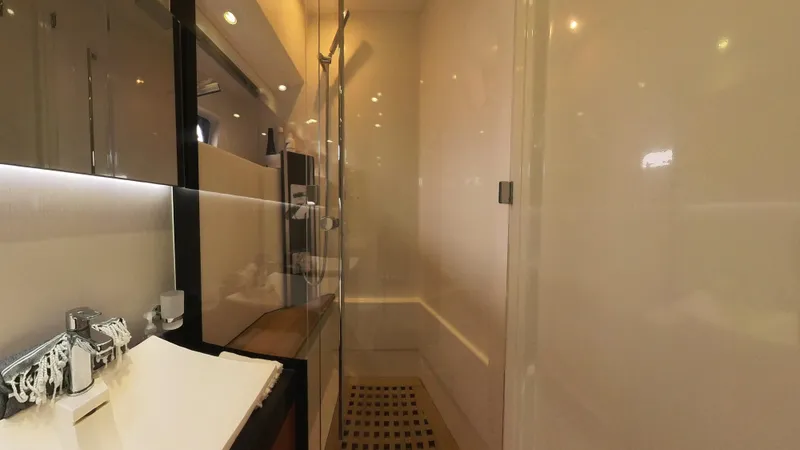 Blue Haven Yacht Photos Pics Luxurious bathroom interior of 2014 Prestige 620S yacht with modern fixtures and glass shower.