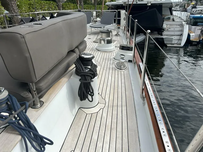 Toto Yacht Photos Pics Deck of a 1983 Palmer Johnson 110 Cruising Sloop yacht, featuring seating and winches.