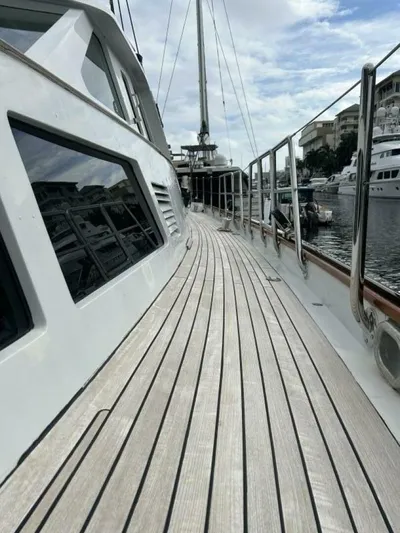 Toto Yacht Photos Pics Deck view of a 1983 Palmer Johnson 110 Cruising Sloop yacht in a marina.