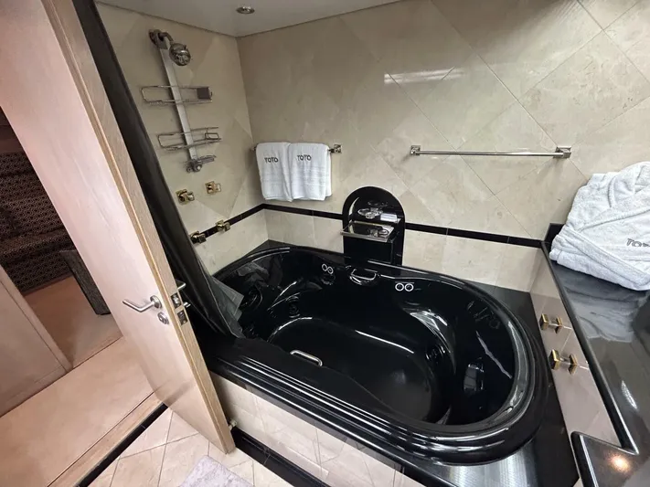 Toto Yacht Photos Pics Luxurious black bathtub in 1983 Palmer Johnson 110 Cruising Sloop yacht bathroom.
