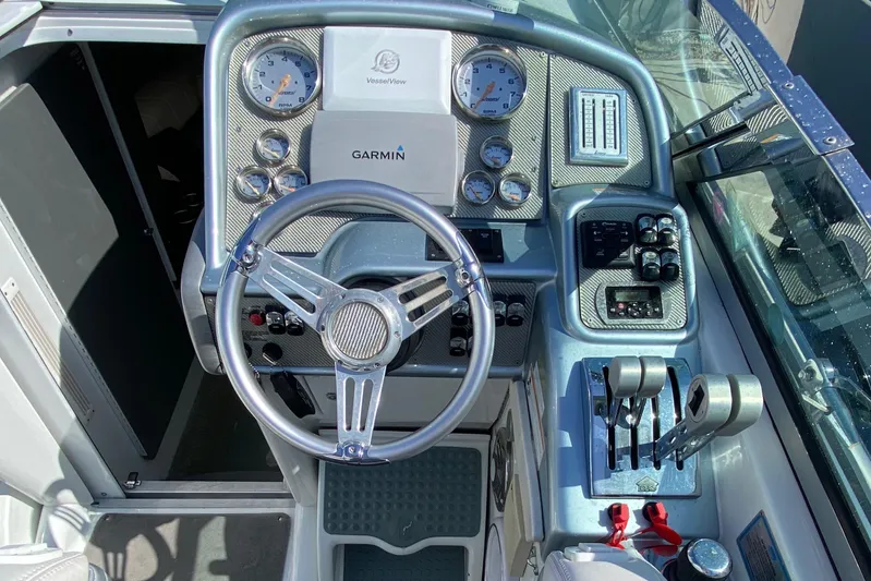  Yacht Photos Pics 2013 Formula 382 FASTech boat cockpit with Garmin navigation system and control panel.