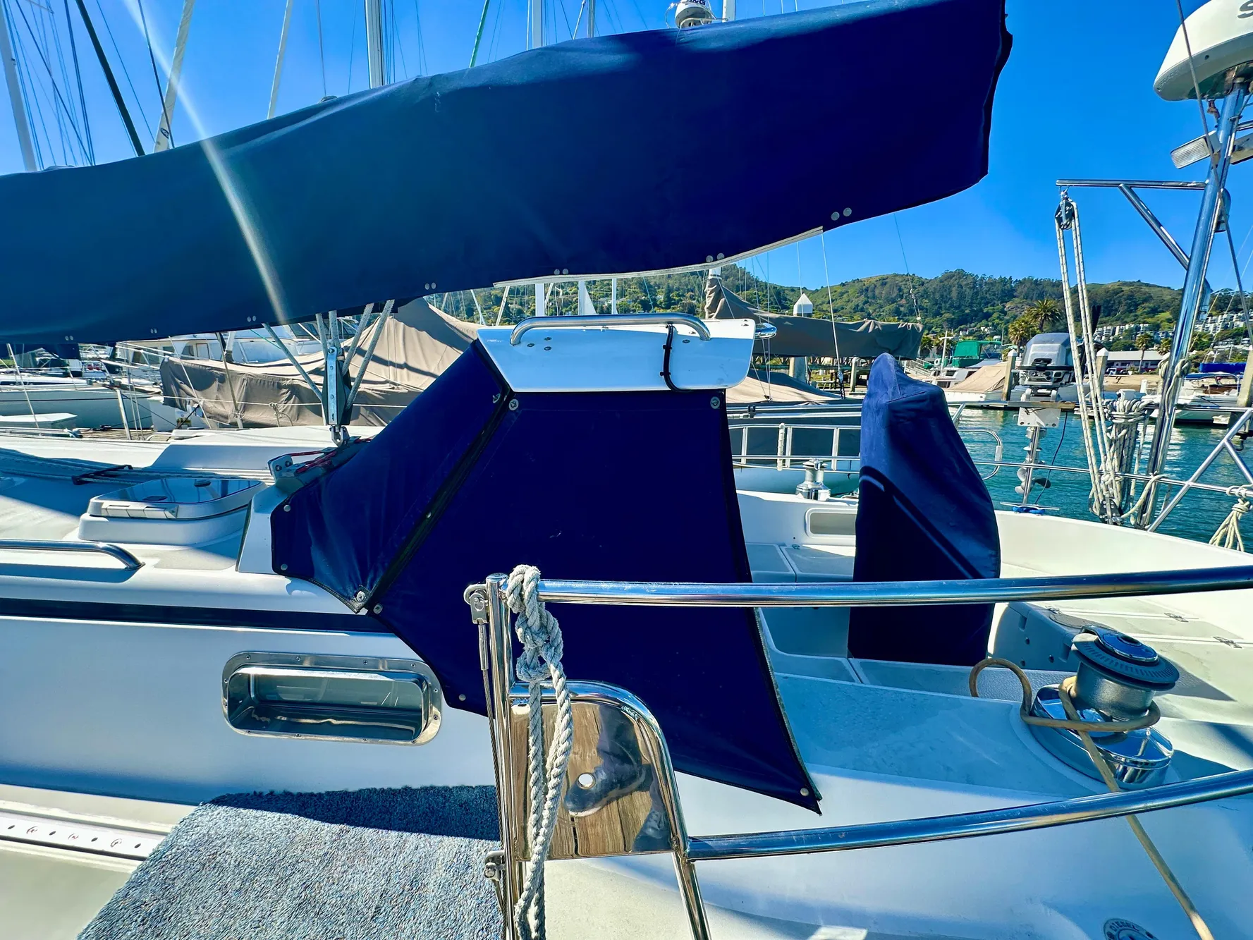Sailboat Valiant 39, 1996 model, docked with blue covers and clear skies.