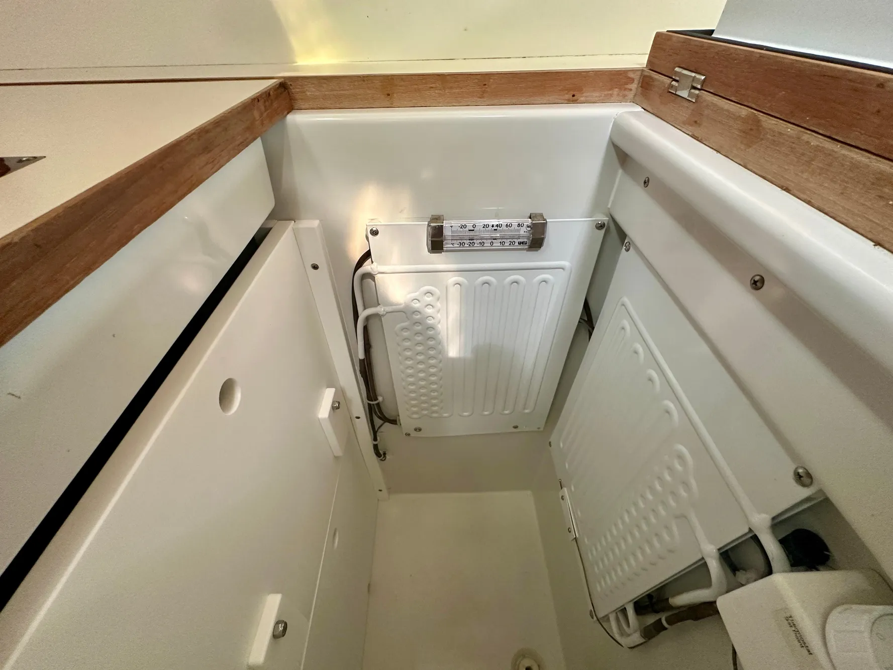 Interior view of a 1996 Valiant 39 sailboat, featuring a compact storage area.