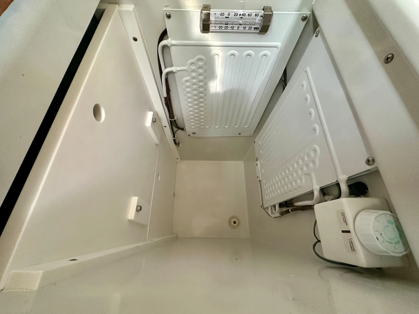Interior view of a 1996 Valiant 39 refrigerator compartment with cooling elements.