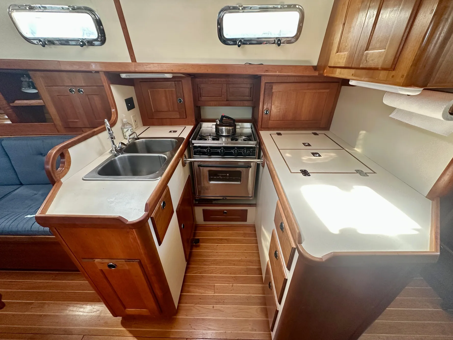 Valiant 39 yacht kitchen interior, featuring wood cabinetry and modern appliances, 1996 model.