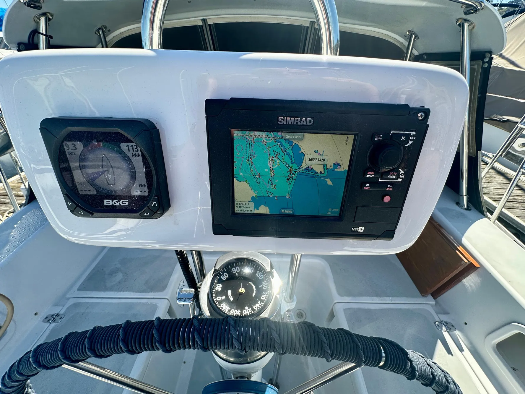 Steering console of 1996 Valiant 39 sailboat with navigation instruments and compass.