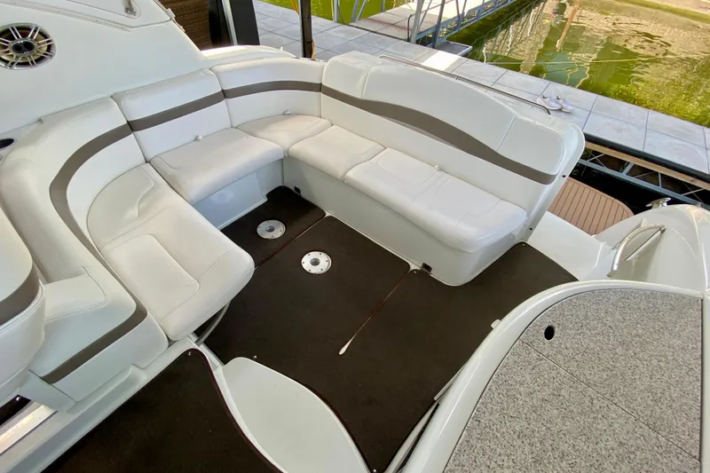  Yacht Photos Pics 2004 Formula 37 PC boat interior with white seating and brown accents near water.