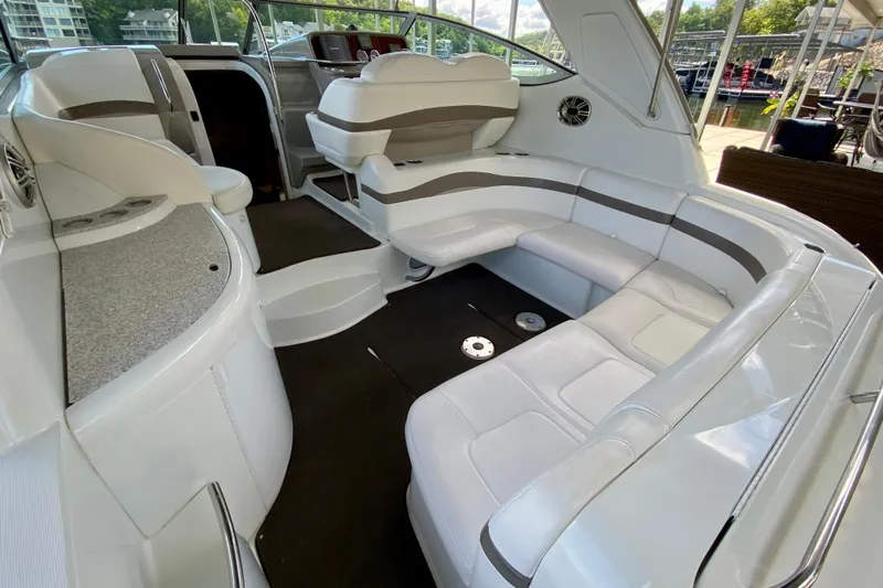  Yacht Photos Pics 2004 Formula 37 PC yacht interior with white seating and modern dashboard.