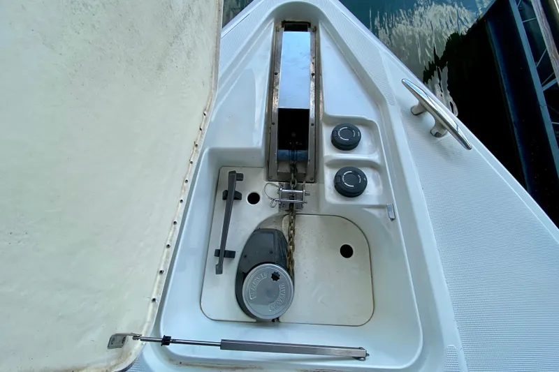  Yacht Photos Pics Anchor compartment of a 2004 Formula 37 PC boat with chain and controls.