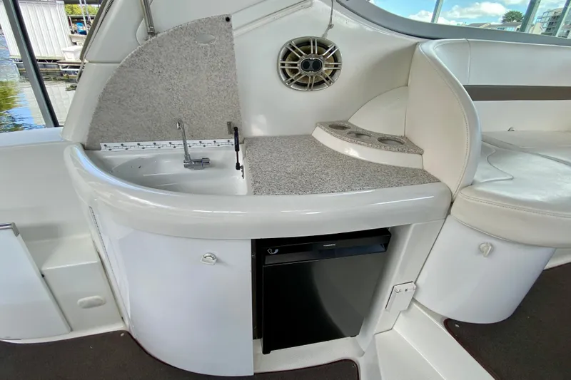  Yacht Photos Pics 2004 Formula 37 PC yacht interior with sink, countertop, and mini fridge.