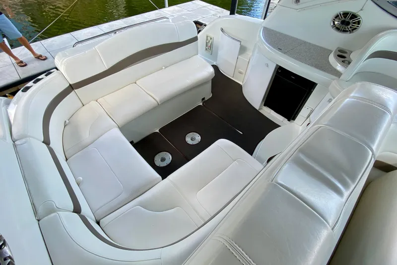  Yacht Photos Pics 2004 Formula 37 PC boat interior with white leather seating and modern amenities.