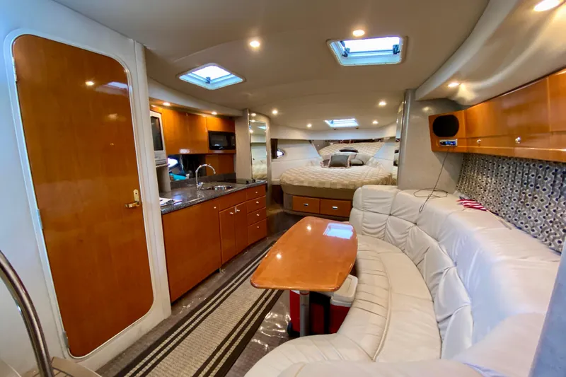  Yacht Photos Pics Luxurious interior of a 2004 Formula 37 PC yacht with modern amenities and cozy seating.