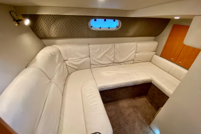  Yacht Photos Pics 2004 Formula 37 PC yacht interior with white leather seating and wood accents.