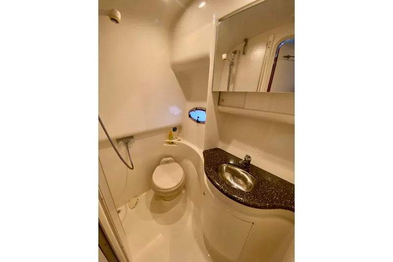  Yacht Photos Pics 2004 Formula 37 PC yacht bathroom with toilet, sink, and shower.