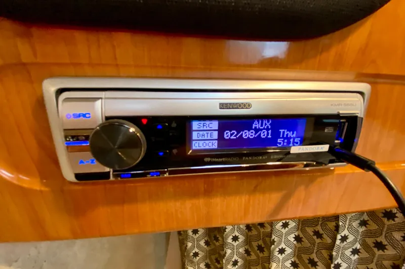  Yacht Photos Pics Kenwood stereo system in 2004 Formula 37 PC boat, displaying AUX mode and time.