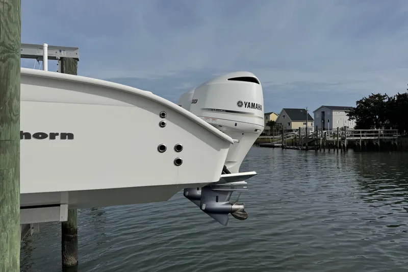  Yacht Photos Pics Cape Horn 31 T boat with Yamaha engine docked by waterfront homes, 2021 model.