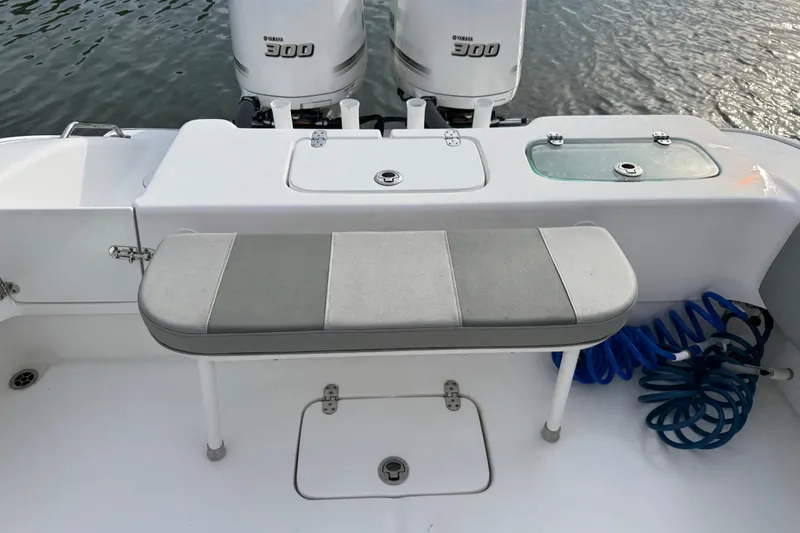  Yacht Photos Pics 2021 Cape Horn 31 T boat with Yamaha 300 engines, featuring a cushioned bench and storage compartments.