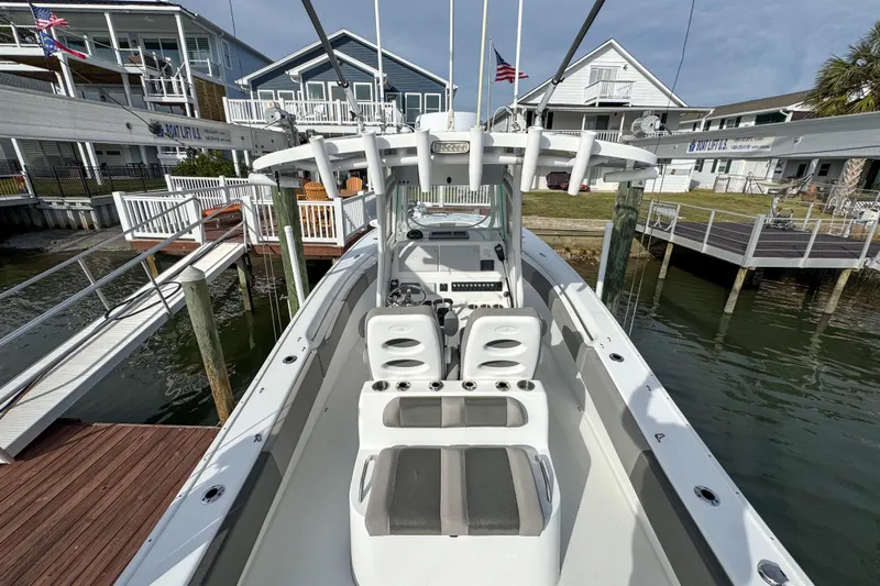  Yacht Photos Pics 2021 Cape Horn 31 T boat docked at marina with residential backdrop.