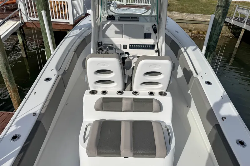  Yacht Photos Pics 2021 Cape Horn 31 T boat interior with seating and console, docked by the water.