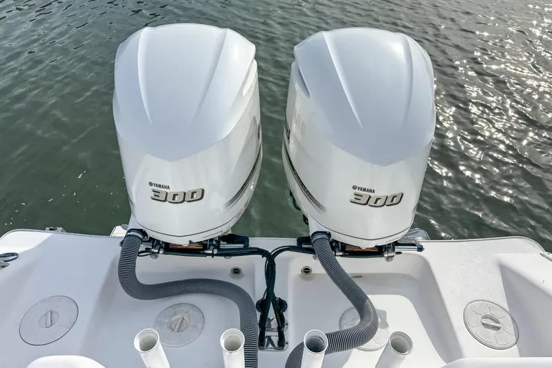  Yacht Photos Pics Twin Yamaha 300 engines on a 2021 Cape Horn 31 T boat, docked on water.