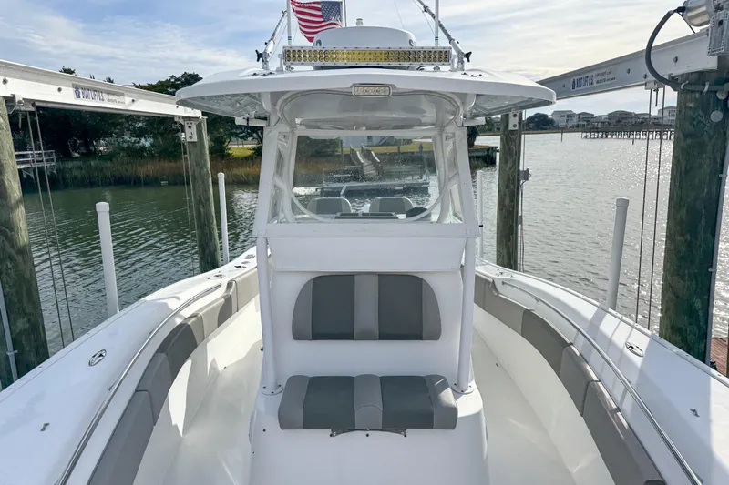  Yacht Photos Pics 2021 Cape Horn 31 T boat docked, featuring sleek design and spacious seating.