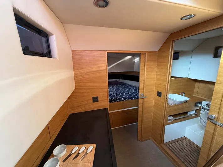  Yacht Photos Pics Luxurious interior of 2021 De Antonio Yachts D42, featuring wood finishes and modern amenities.