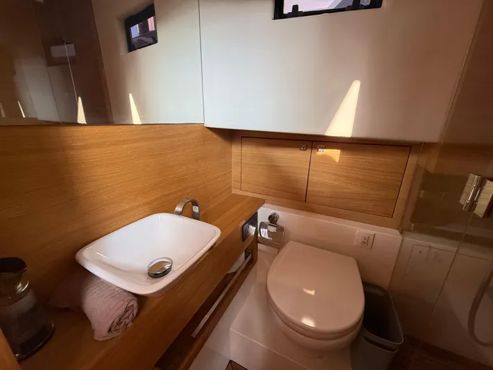  Yacht Photos Pics Luxurious bathroom in 2021 De Antonio Yachts D42, featuring modern sink and toilet.