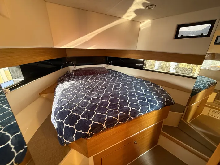  Yacht Photos Pics Luxurious cabin interior of 2021 De Antonio Yachts D42 with cozy bed and modern design.