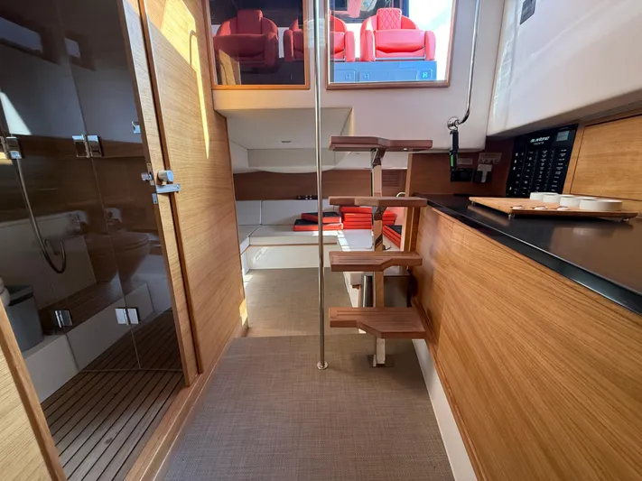  Yacht Photos Pics Interior of 2021 De Antonio Yachts D42, featuring modern wood finishes and compact design.