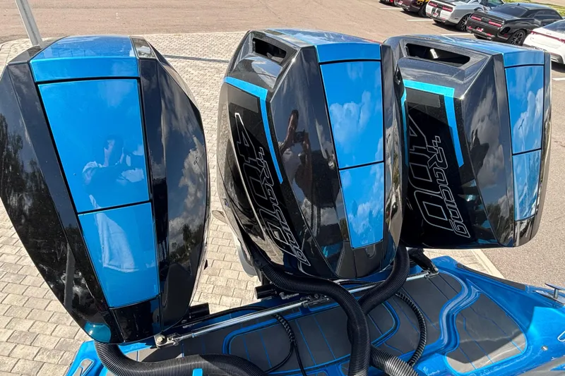  Yacht Photos Pics Triple blue and black outboard motors on a 2024 GSX 36 boat.