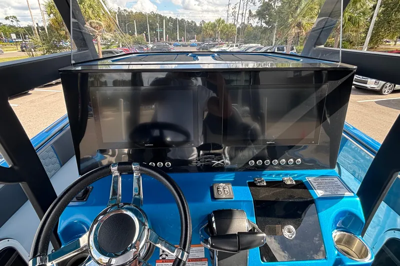  Yacht Photos Pics 2024 GSX 36 boat dashboard with steering wheel and dual screens.