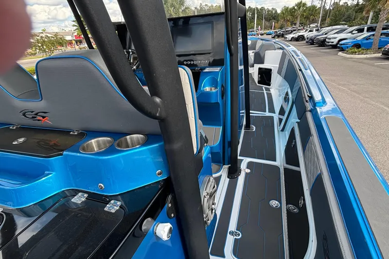  Yacht Photos Pics 2024 GSX 36 boat interior with blue accents, modern seating, and cup holders.