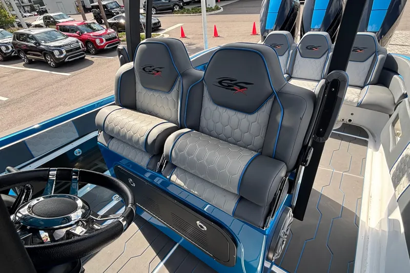  Yacht Photos Pics 2024 GSX 36 boat interior with stylish seating and modern steering wheel design.