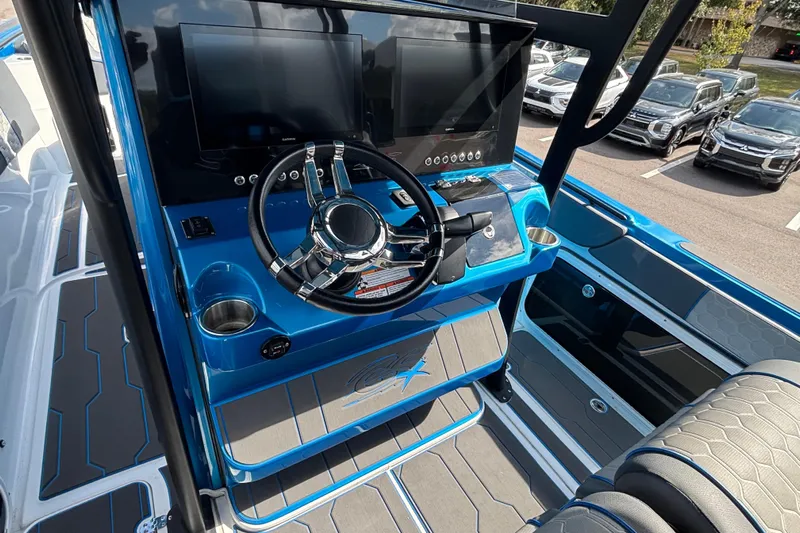  Yacht Photos Pics 2024 GSX 36 boat dashboard with dual screens and modern steering wheel.